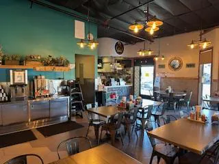 Hanoi-Chicken-Noodle-Vietnamese-Restaurant-San-Leandro The same restaurant from a different angle, showing the counter area, coffee station, and large windows letting in natural light.